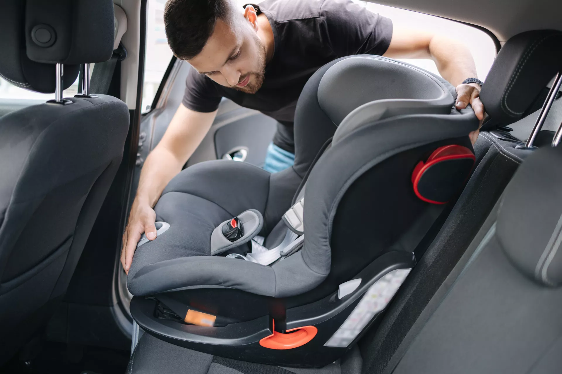 Man inspecting car seat
