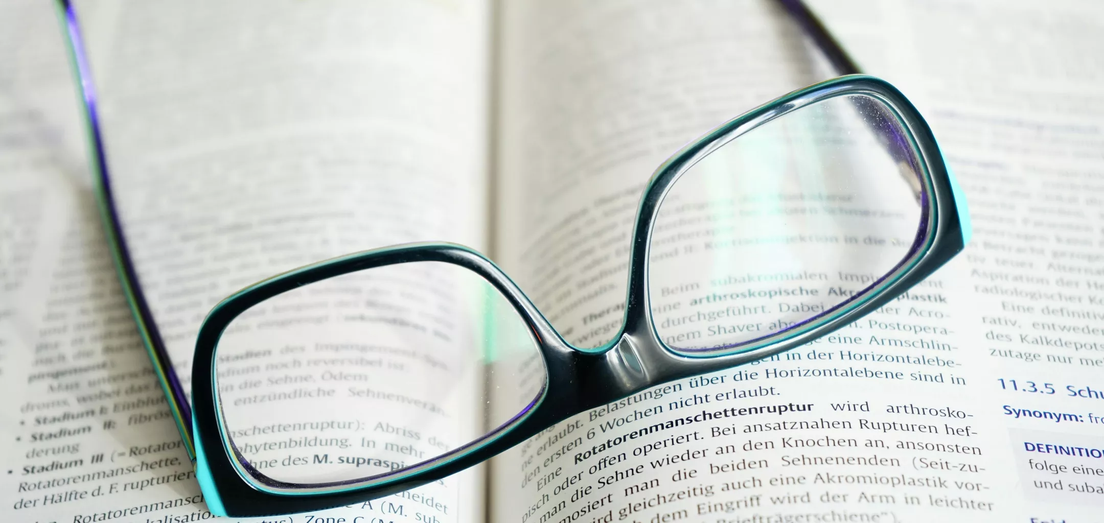 reading glasses on open book